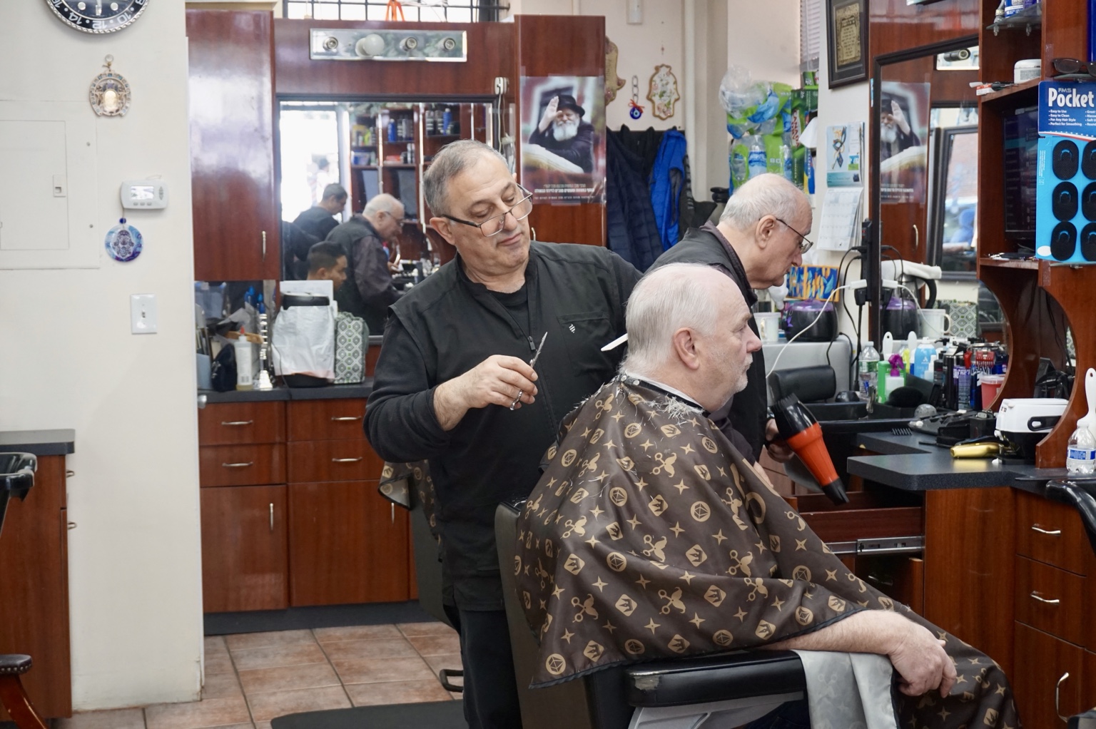 A haircut in progress in the barber chair